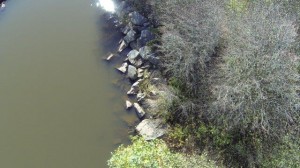 Vertical aerial closeup of island shore line duck pond Halifax